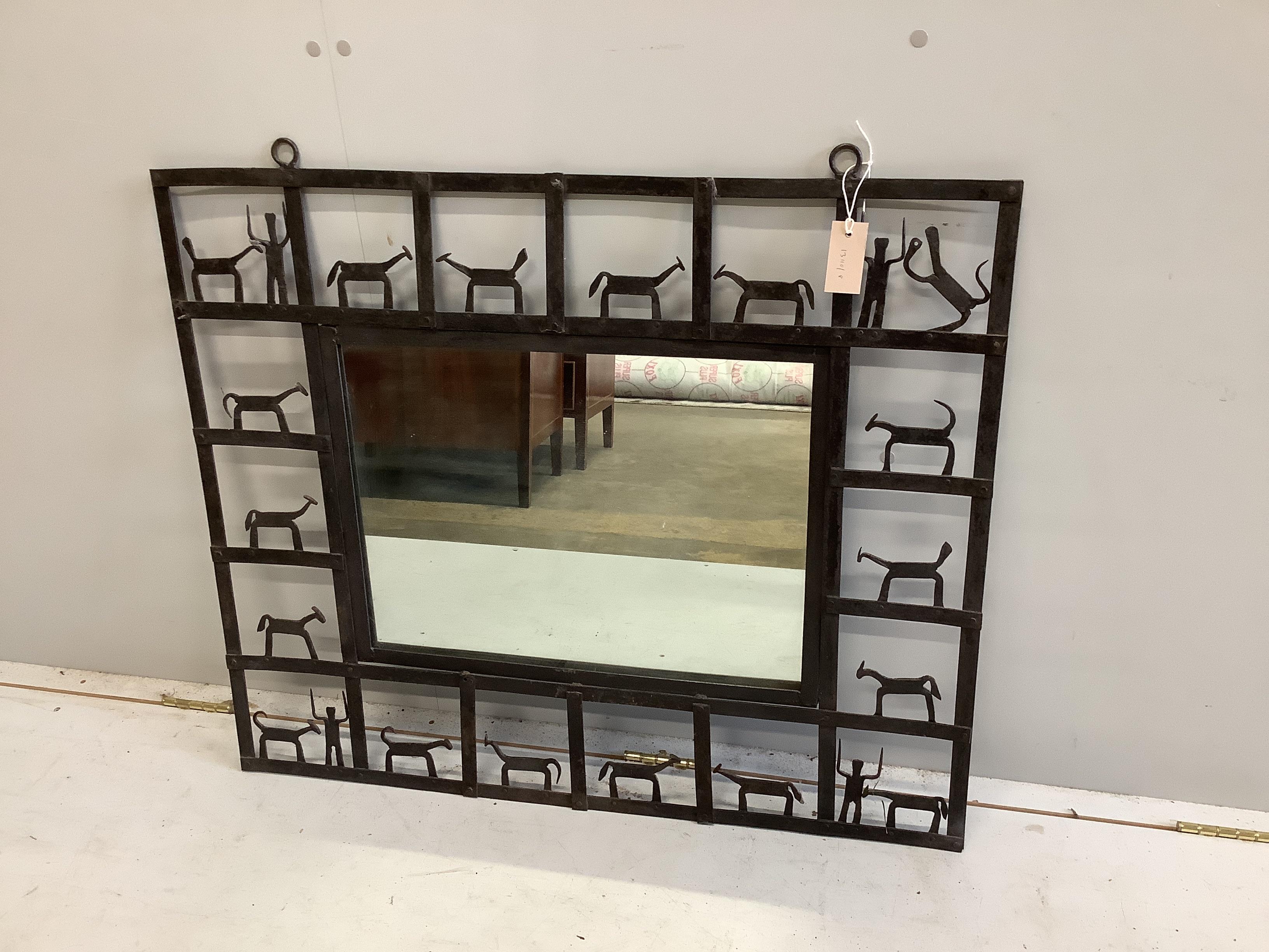 A rectangular wrought and cut metal wall mirror by Frederick Weinberg, width 92cm, height 77cm